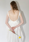 Róhe Sculptural Textured Cotton Dress in Off White. Long, v-neck dress with low back and gathered skirt. 