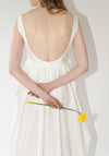 Róhe Sculptural Textured Cotton Dress in Off White. Long, v-neck dress with low back and gathered skirt. 