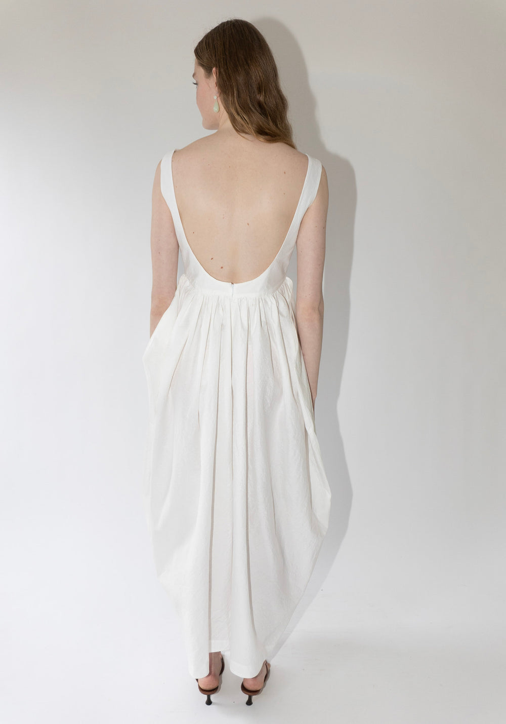 Róhe Sculptural Textured Cotton Dress in Off White. Long, v-neck dress with low back and gathered skirt. 