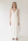Róhe Sculptural Textured Cotton Dress in Off White. Long, v-neck dress with low back and gathered skirt. 