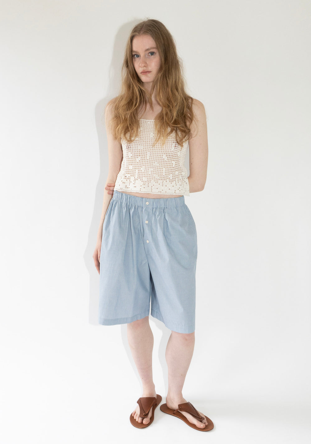 Keep Shorts in Blue Stripe from Baserange. Organic cotton poplin shirts with elastic waistband, buttons at half button placket and pockets at the side seams. 