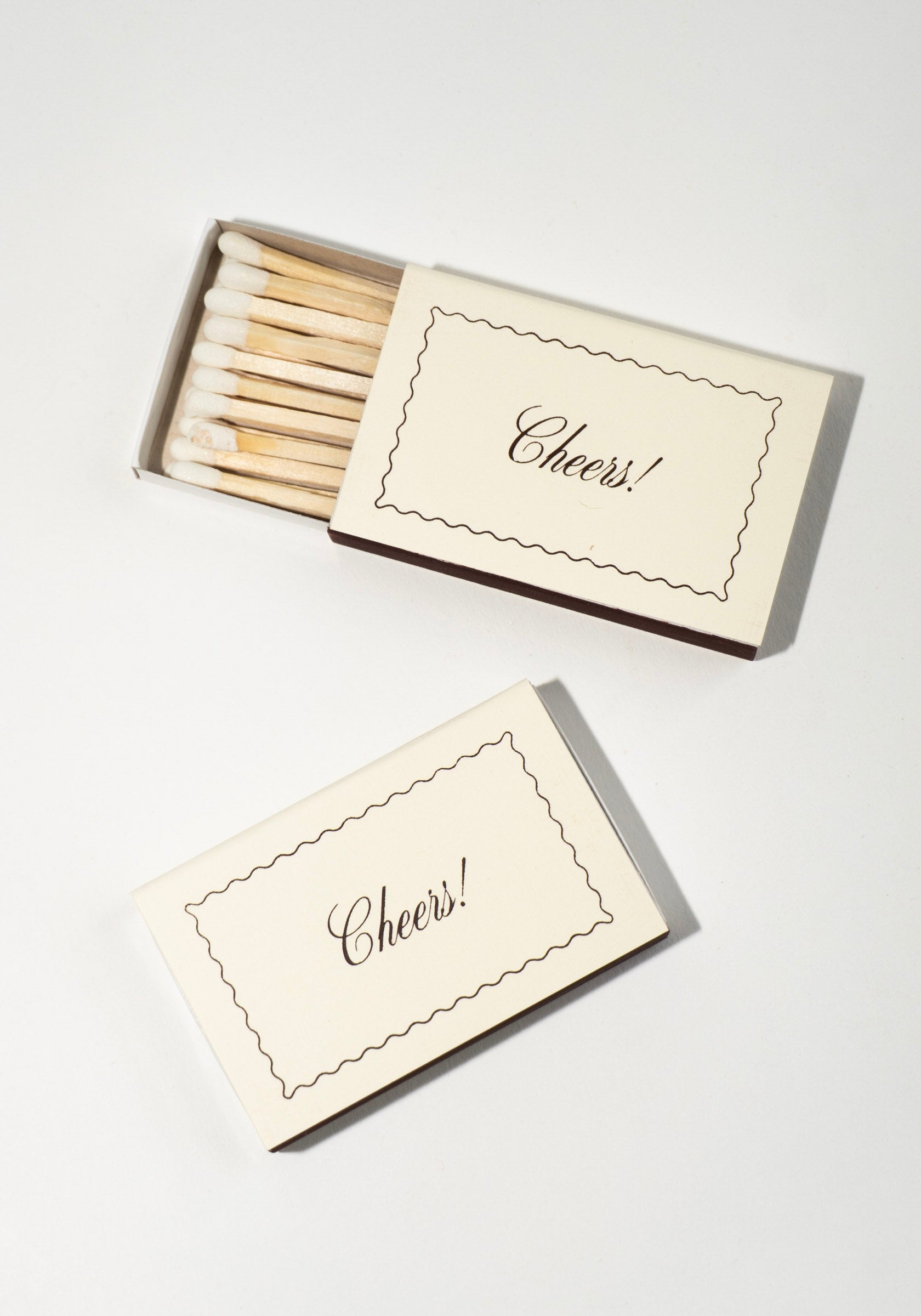 Matches with 'Cheers!' packaging on a white background