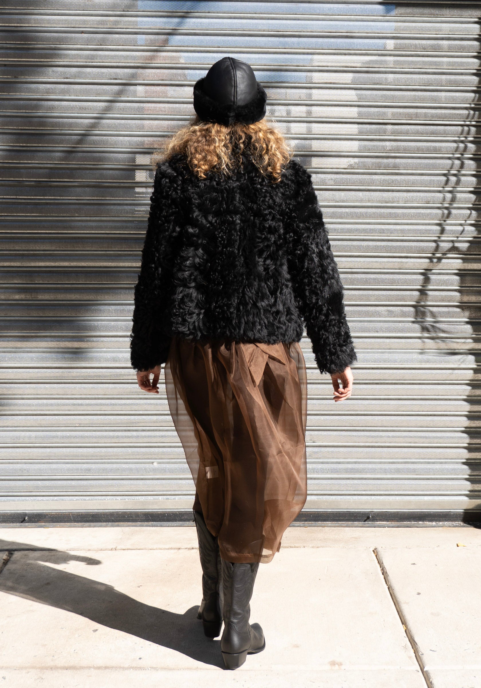 Leather Back Straight Hair Sheepskin Cap in Black