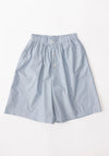 Keep Shorts in Blue Stripe from Baserange. Organic cotton poplin shirts with elastic waistband, buttons at half button placket and pockets at the side seams. 