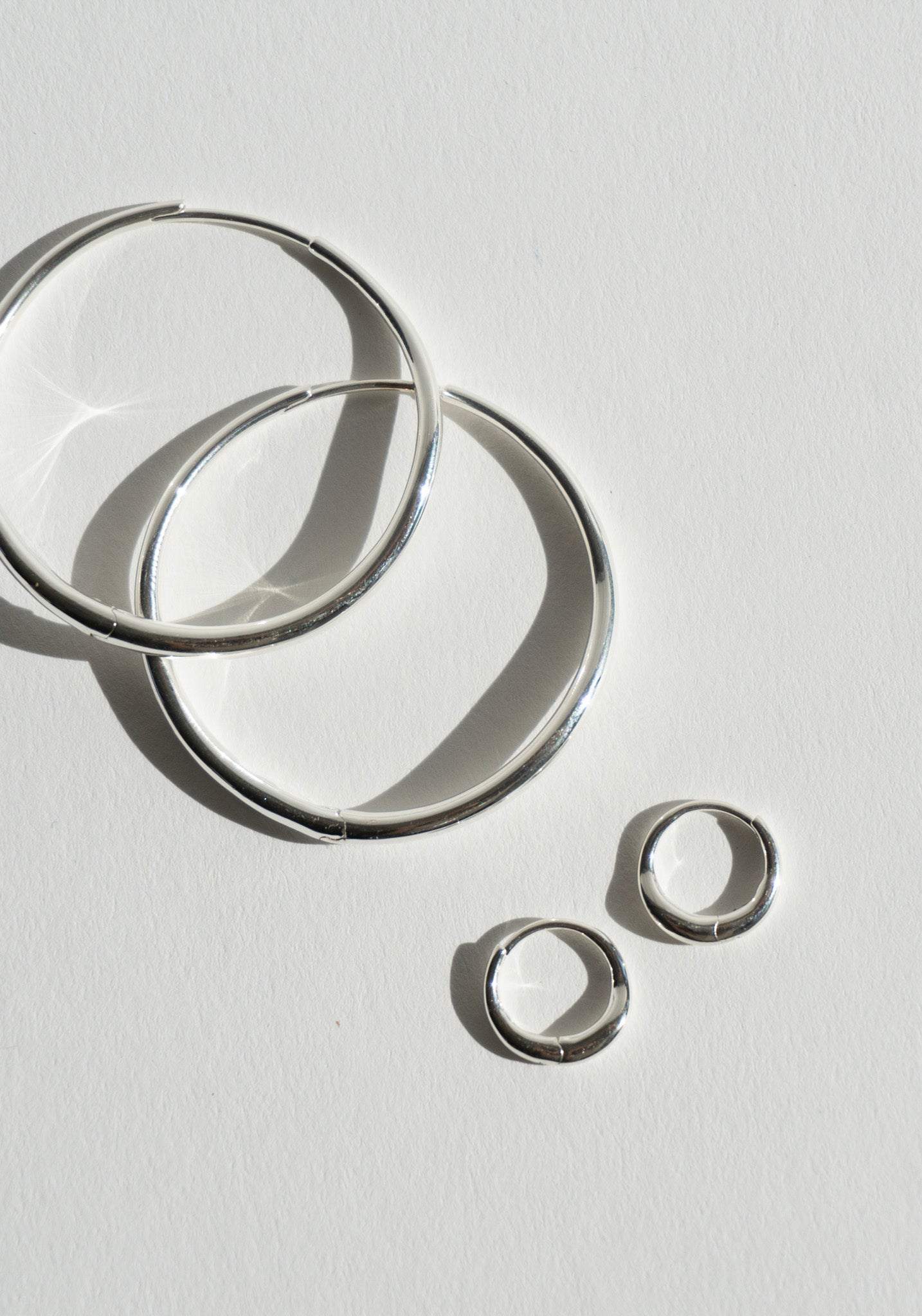 Nina Gordon Momento Baby Hoops in Silver