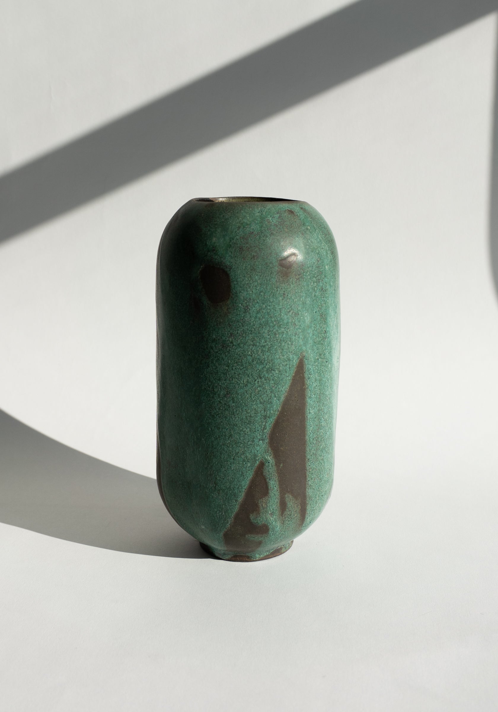 Mondays Ceramics Cylinder Vase in Green Patina on Umber