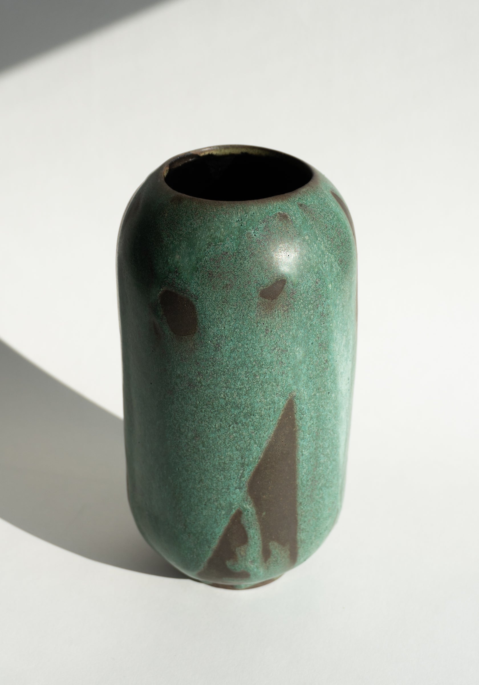 Mondays Ceramics Cylinder Vase in Green Patina on Umber