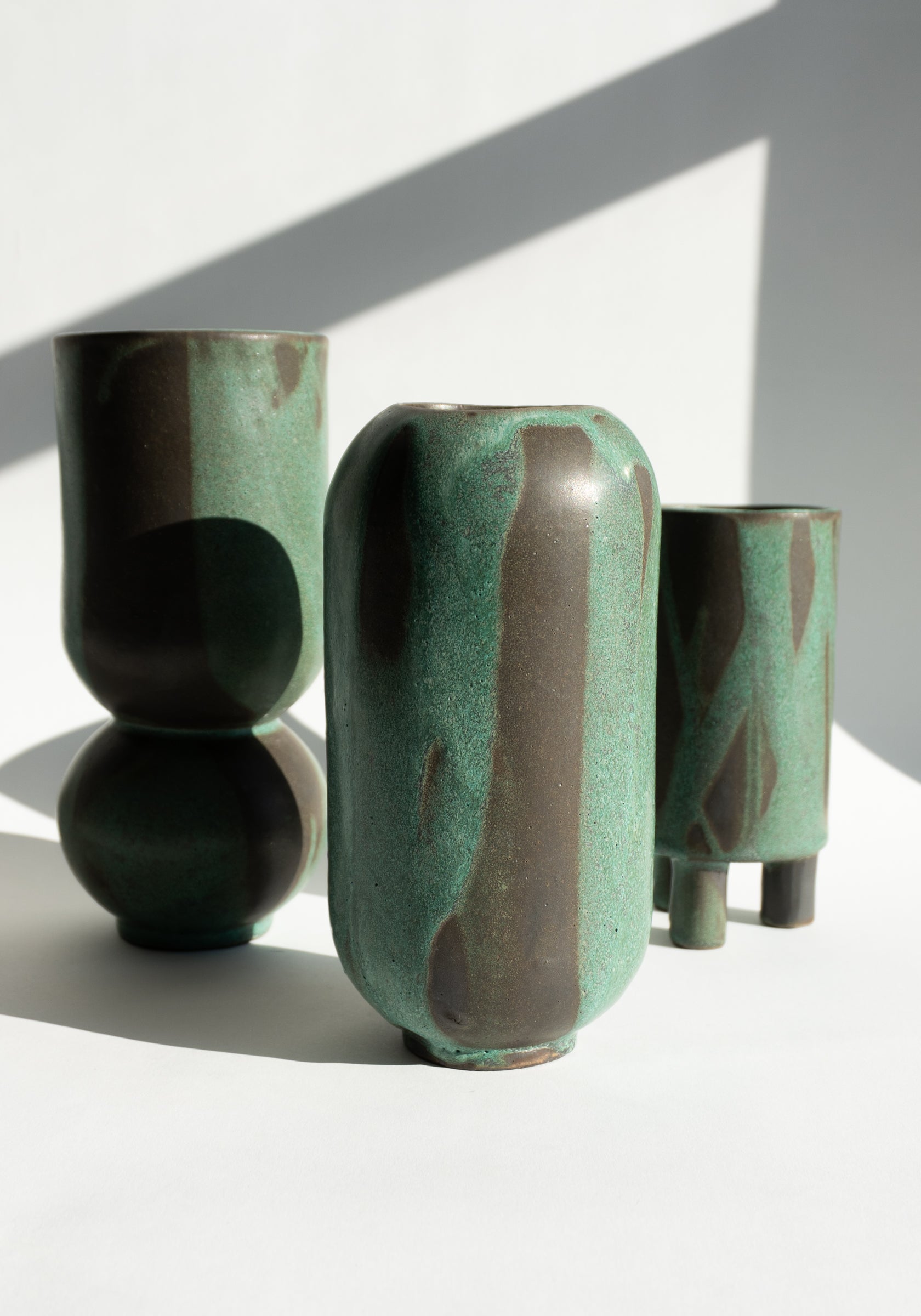 Mondays Ceramics Cylinder Vase in Green Patina on Umber