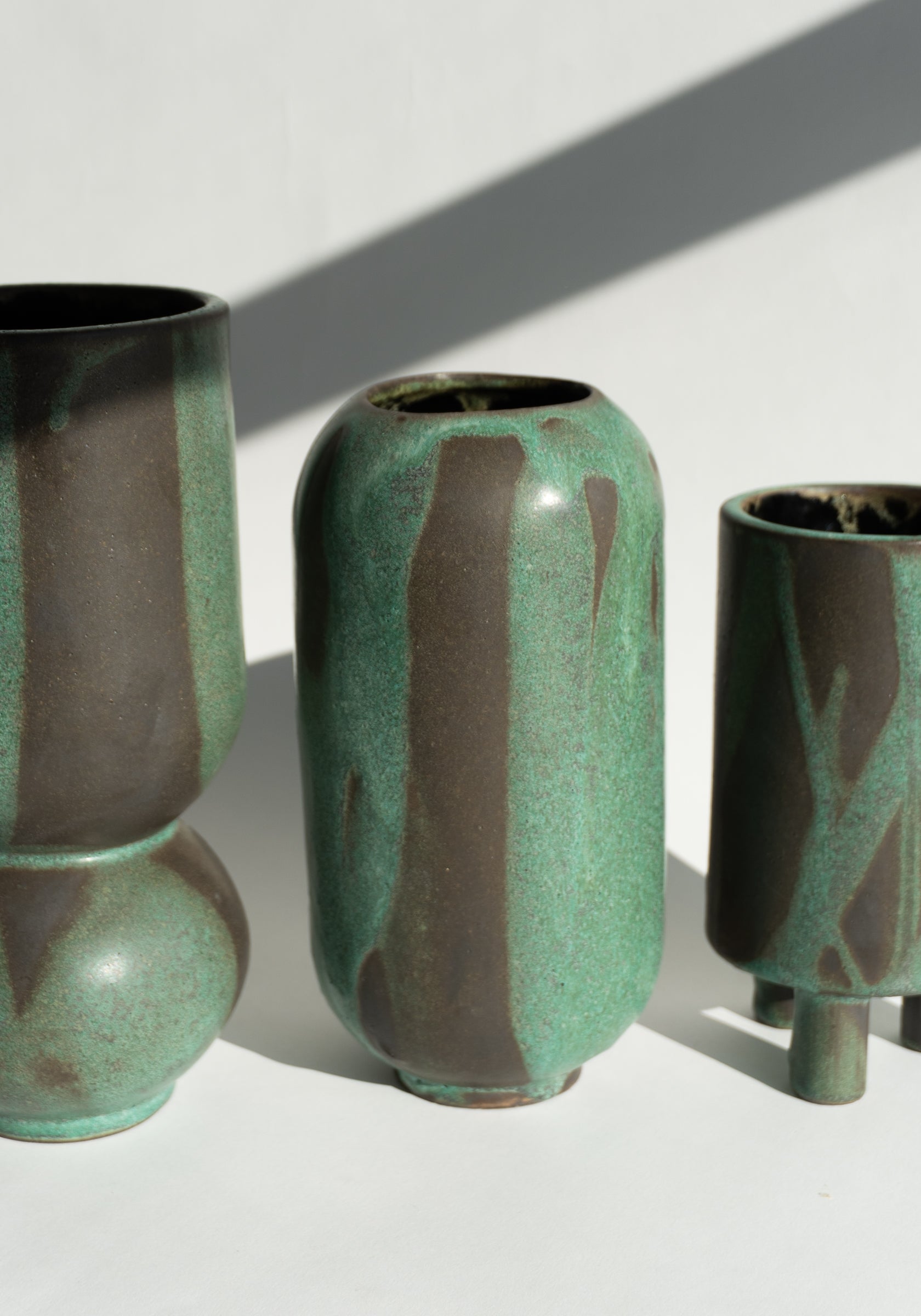 Mondays Ceramics Cylinder Vase in Green Patina on Umber